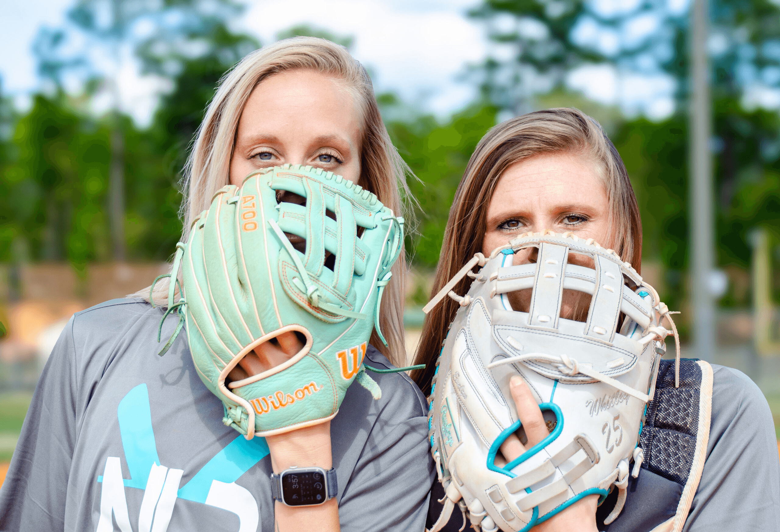 Next Level Performance coaches posing with their softball gloves